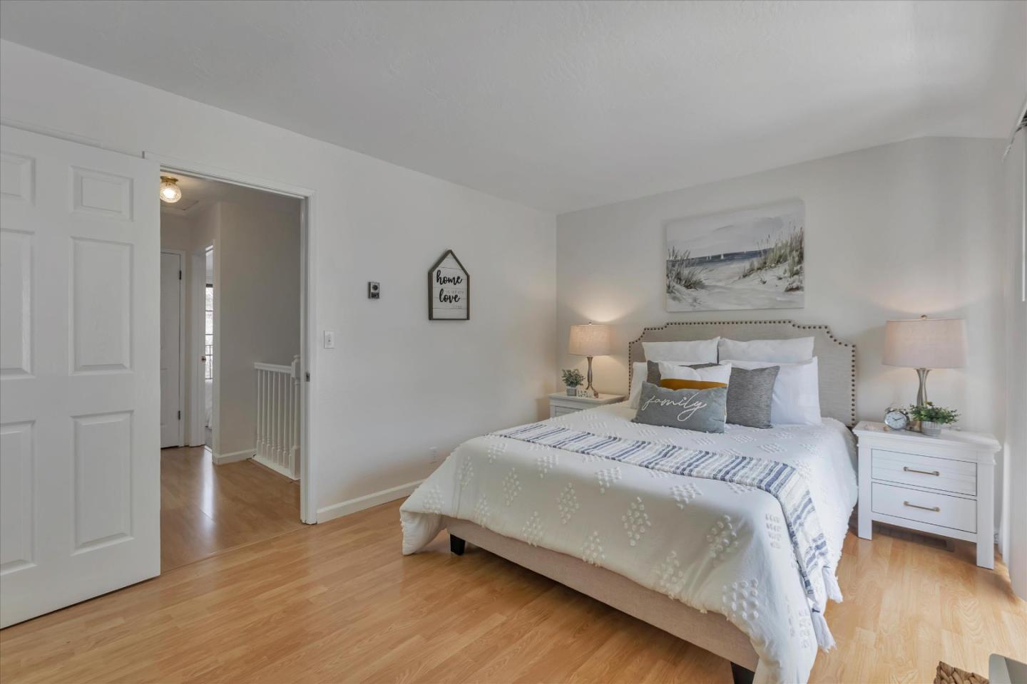 38 Devonshire Avenue, Unit 2 Mountain View, CA 94043 - Photo 20 of 38 a bedroom with a bed and wooden floor