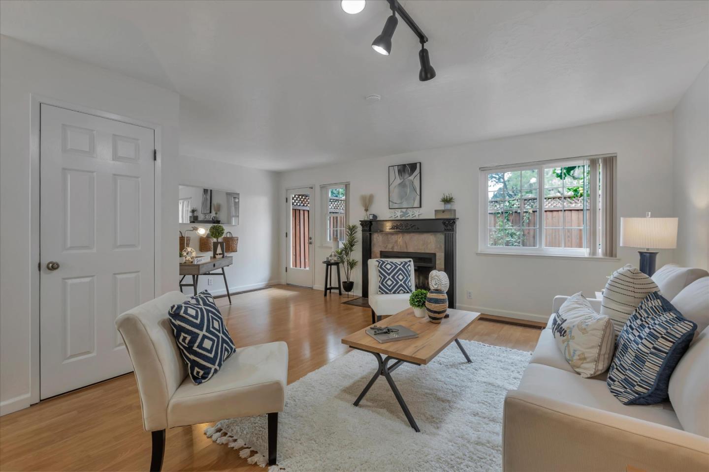 38 Devonshire Avenue, Unit 2 Mountain View, CA 94043 - Photo 2 of 38 a living room with furniture a fireplace and a window