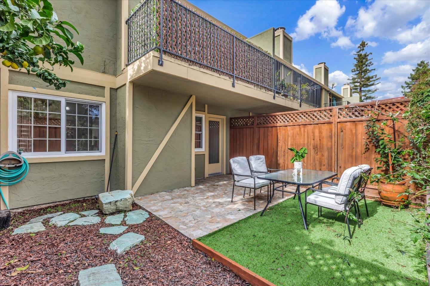 38 Devonshire Avenue, Unit 2 Mountain View, CA 94043 - Photo 31 of 38 a view of a house with backyard sitting area and garden