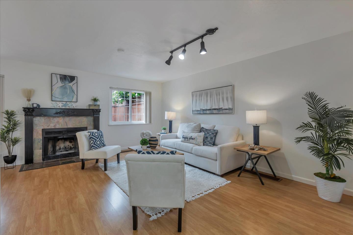 38 Devonshire Avenue, Unit 2 Mountain View, CA 94043 - Photo 4 of 38 a living room with furniture and a fireplace