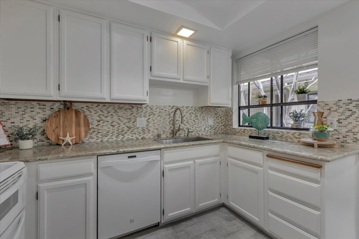 38 Devonshire Avenue, Unit 2 Mountain View, CA 94043 - Photo 9 of 38 a kitchen with white cabinets and white appliances
