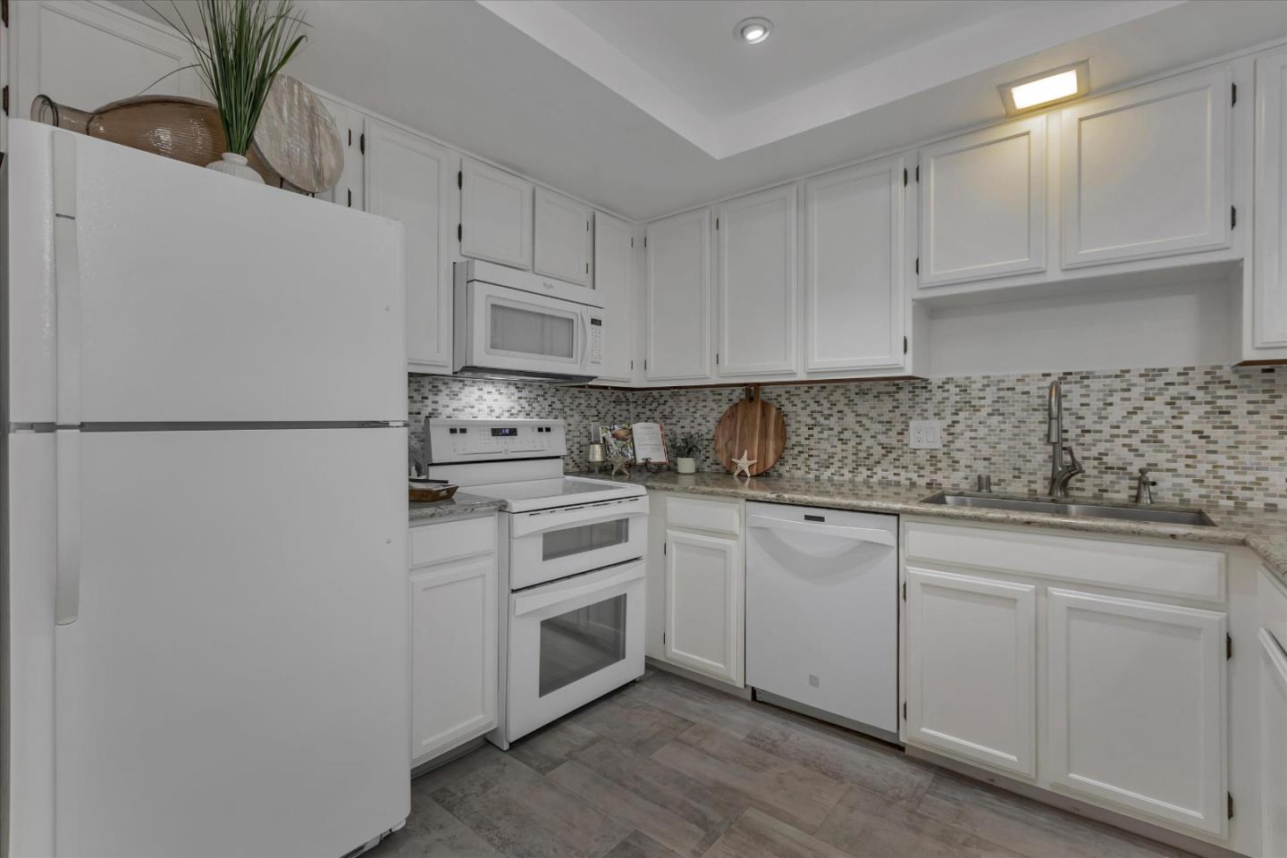 38 Devonshire Avenue, Unit 2 Mountain View, CA 94043 - Photo 10 of 38 a kitchen with appliances a sink and cabinets
