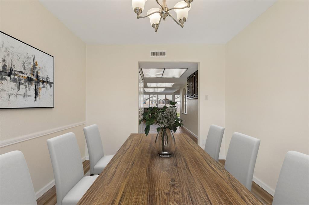 9305 Pollard Street Rowlett, TX 75088 - Photo 11 of 30 a view of a room with furniture and wooden floor