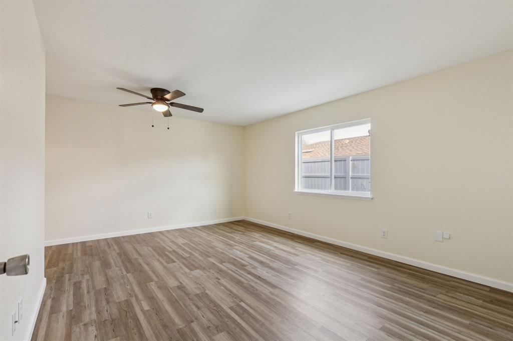 9305 Pollard Street Rowlett, TX 75088 - Photo 19 of 30 wooden floor in an empty room with a window