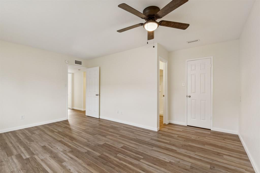 9305 Pollard Street Rowlett, TX 75088 - Photo 21 of 30 a view of an empty room and wooden floor