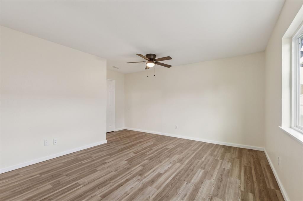 9305 Pollard Street Rowlett, TX 75088 - Photo 24 of 30 wooden floor in an empty room with a window