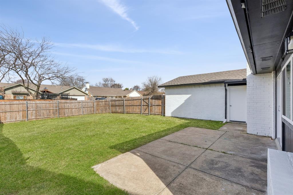 9305 Pollard Street Rowlett, TX 75088 - Photo 27 of 30 a view of backyard of house with green space