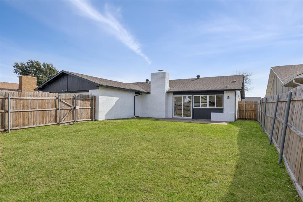 9305 Pollard Street Rowlett, TX 75088 - Photo 28 of 30 a view of a house with backyard and garden