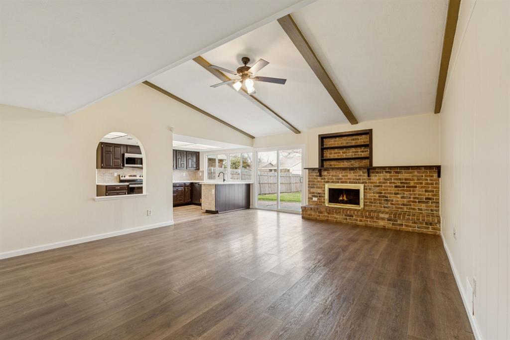 9305 Pollard Street Rowlett, TX 75088 - Photo 3 of 30 a view of a livingroom with furniture wooden floor and window