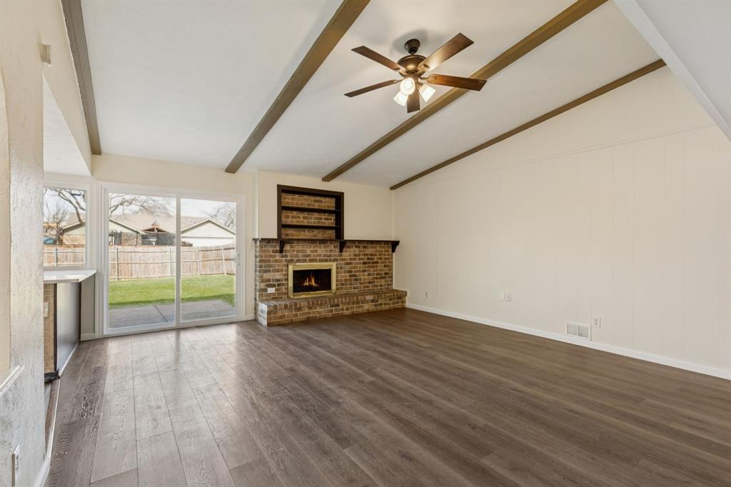 9305 Pollard Street Rowlett, TX 75088 - Photo 4 of 30 a view of a livingroom with wooden floor