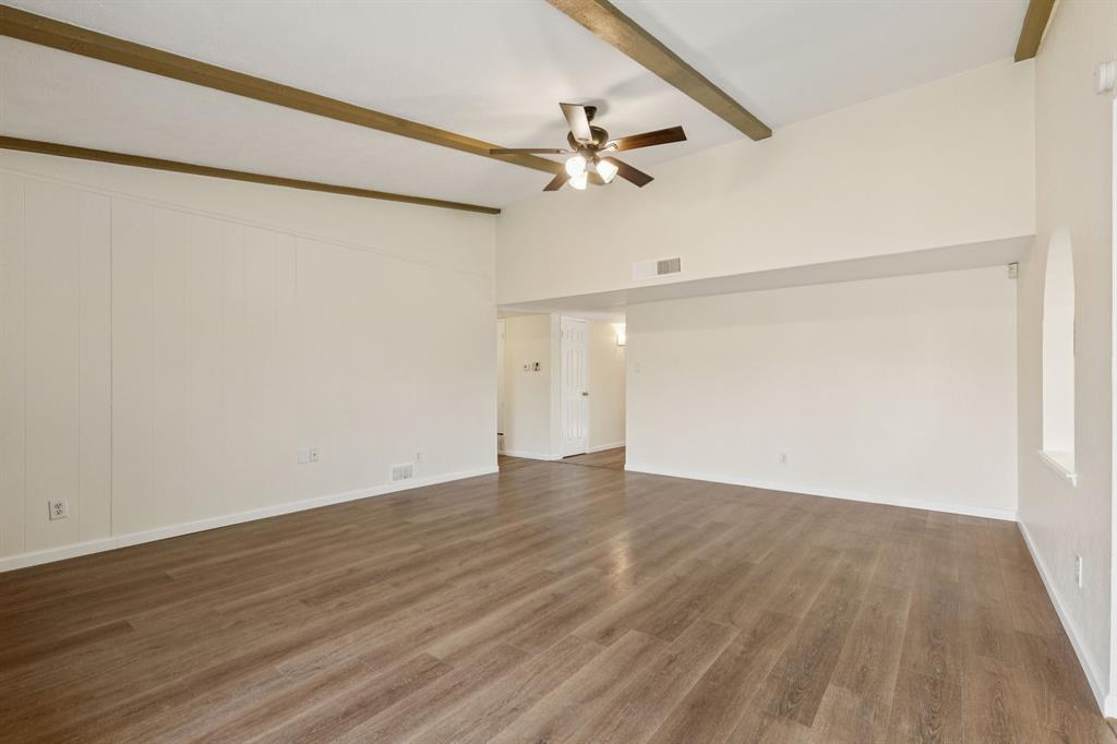 9305 Pollard Street Rowlett, TX 75088 - Photo 5 of 30 a view of an empty room with wooden floor