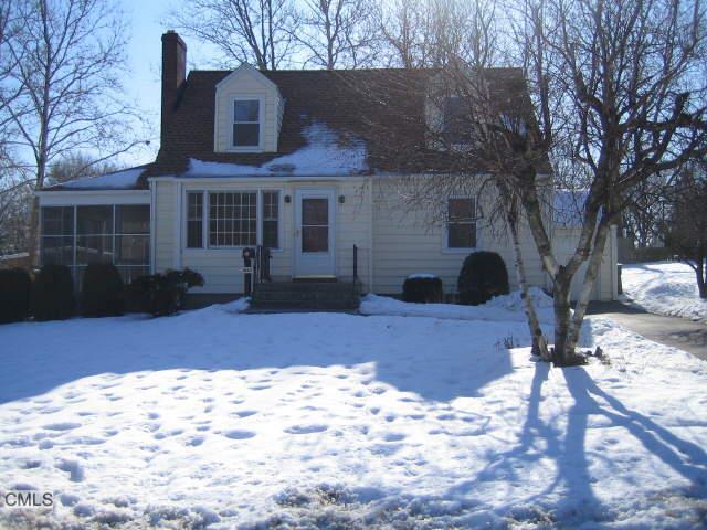 3243 Old Town Road Bridgeport, CT 06606 - Photo 1 of 1 a front view of a house with a yard covered in snow
