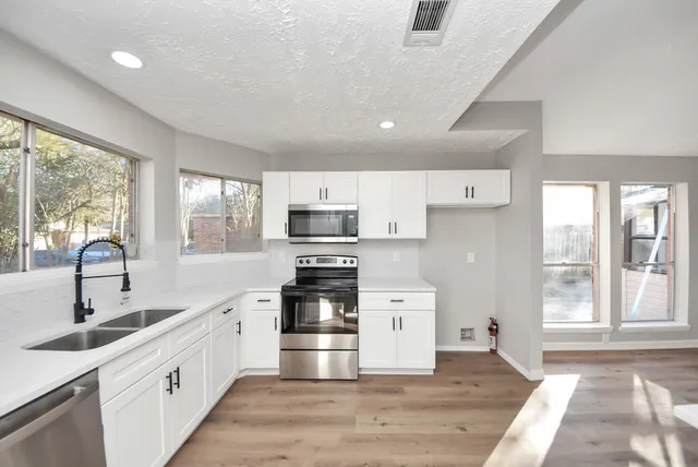 a view of a room with a large window