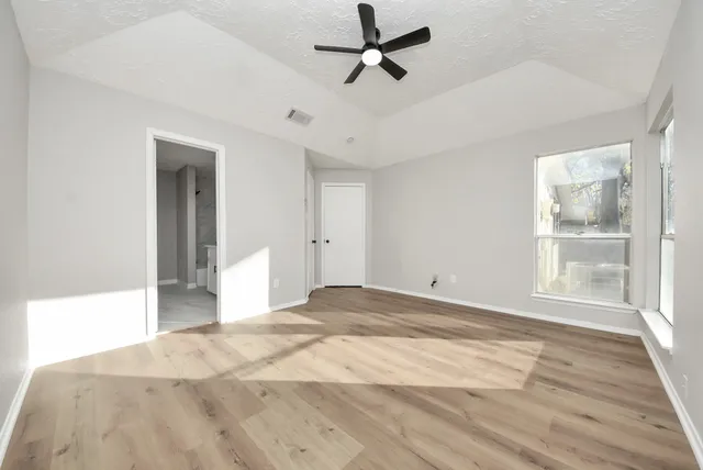 a bathroom with a sink a large mirror and a vanity