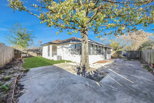 a backyard of a house with lots of green space