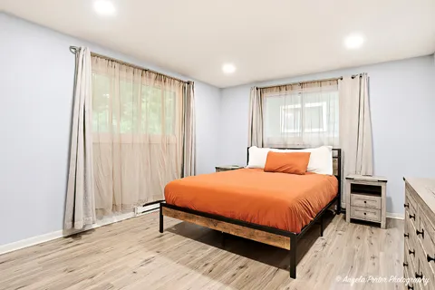 a bed room with a bed and a window