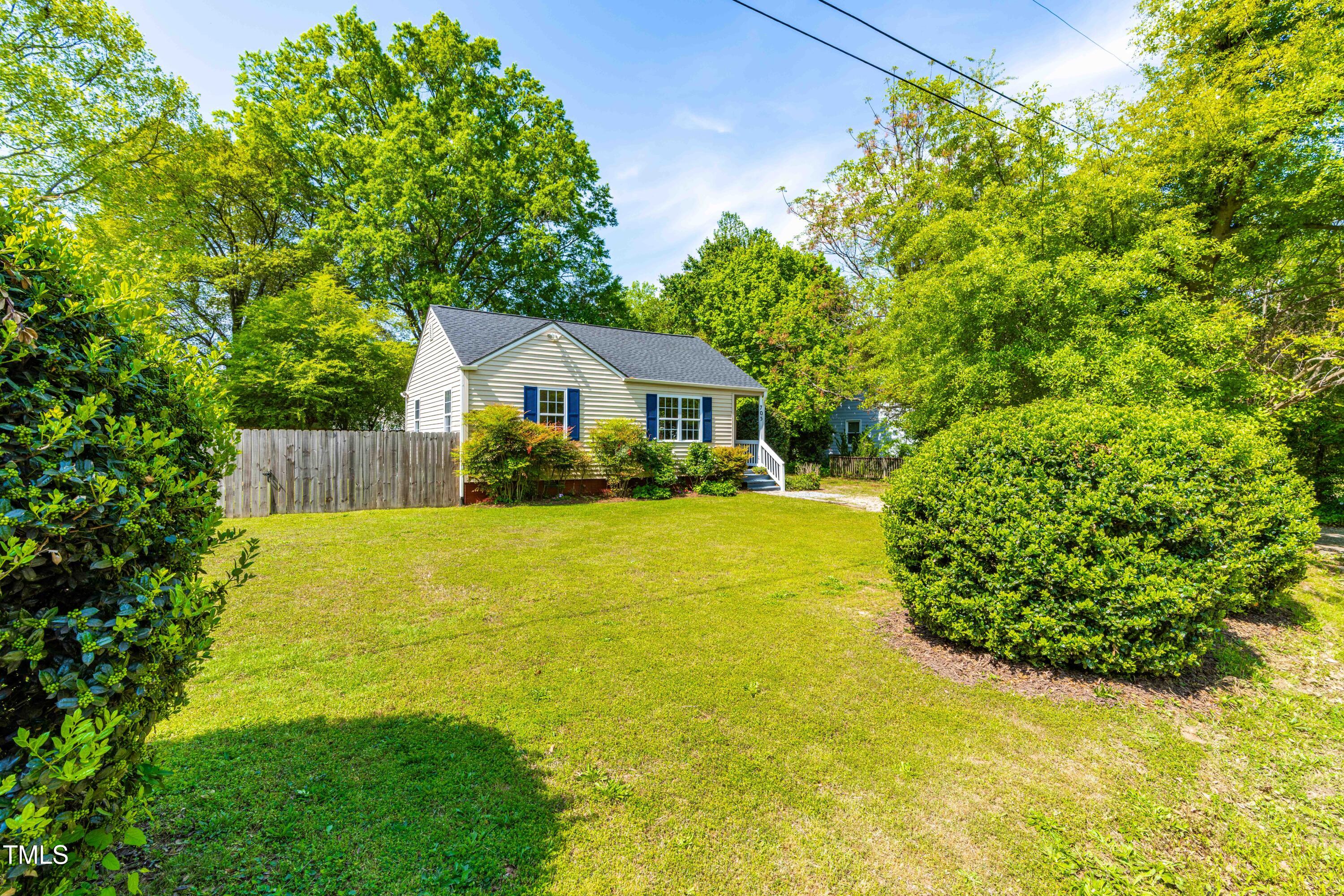 705 Hartford Road Raleigh, NC 27610 - Photo 3 of 24 a front view of a house with a yard