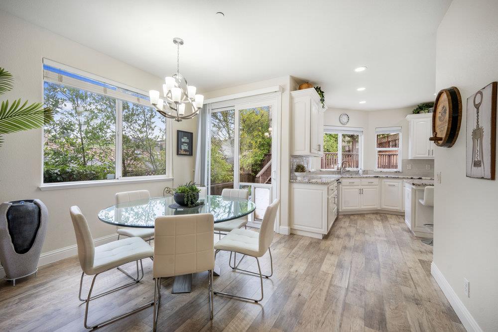 2360 Sunflower Circle Gilroy, CA 95020 - Photo 13 of 49 a view of a dining room with furniture wooden floor and chandelier