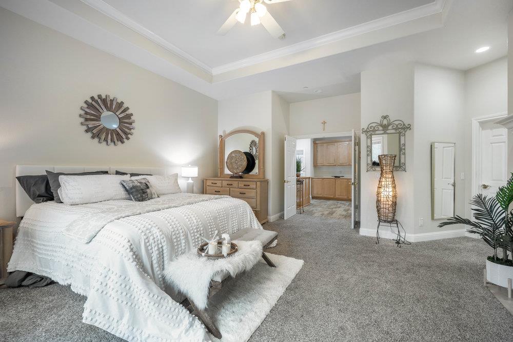 2360 Sunflower Circle Gilroy, CA 95020 - Photo 20 of 49 a spacious bedroom with a bed and a chandelier