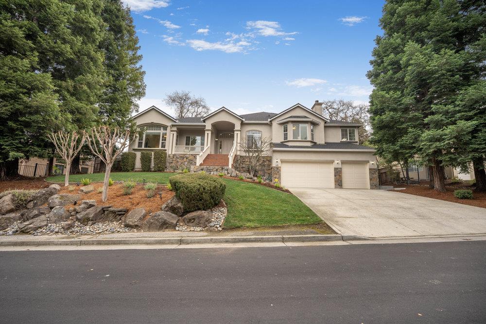 2360 Sunflower Circle Gilroy, CA 95020 - Photo 2 of 49 a front view of a house with a garden