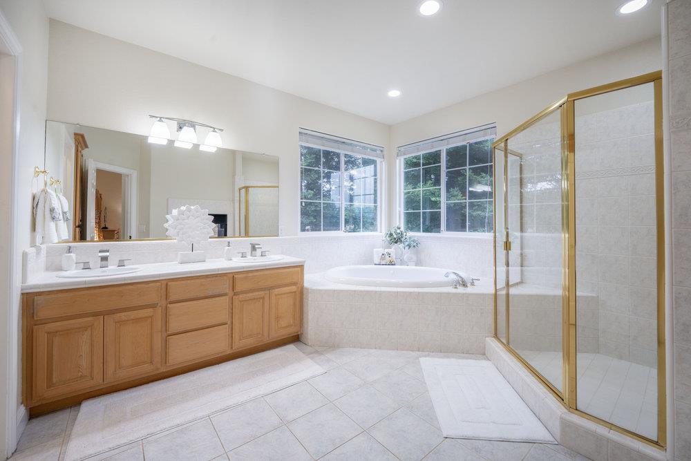 2360 Sunflower Circle Gilroy, CA 95020 - Photo 21 of 49 a bathroom with a tub sink shower and mirror