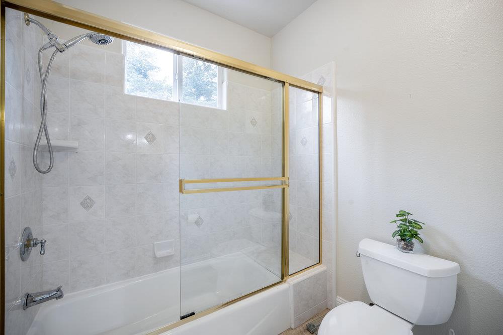 2360 Sunflower Circle Gilroy, CA 95020 - Photo 26 of 49 a bathroom with a granite countertop bathtub shower and toilet