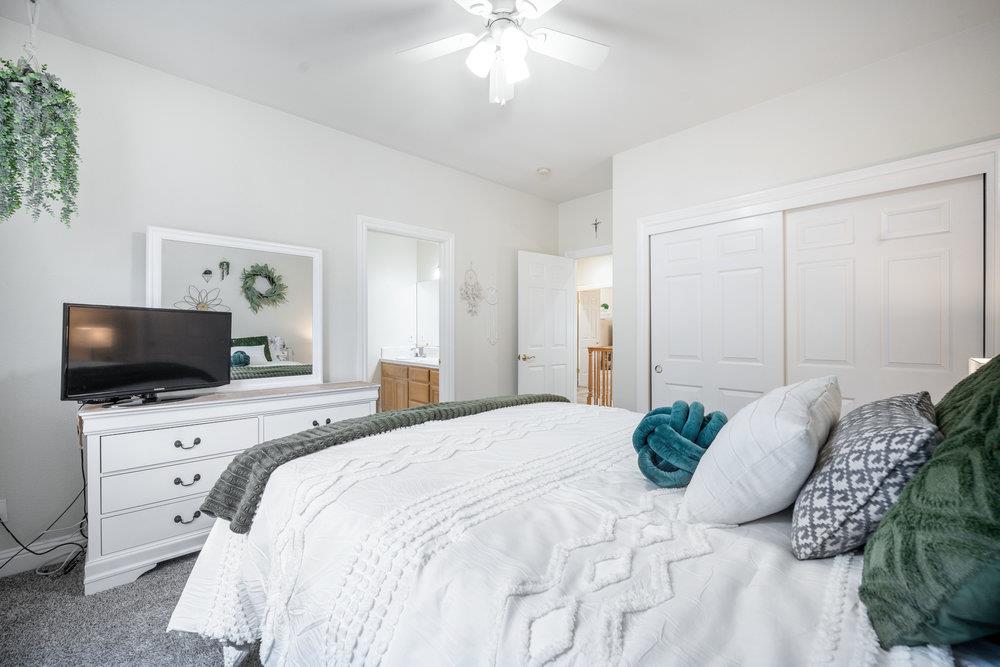 2360 Sunflower Circle Gilroy, CA 95020 - Photo 28 of 49 a bedroom with a bed and a flat screen tv