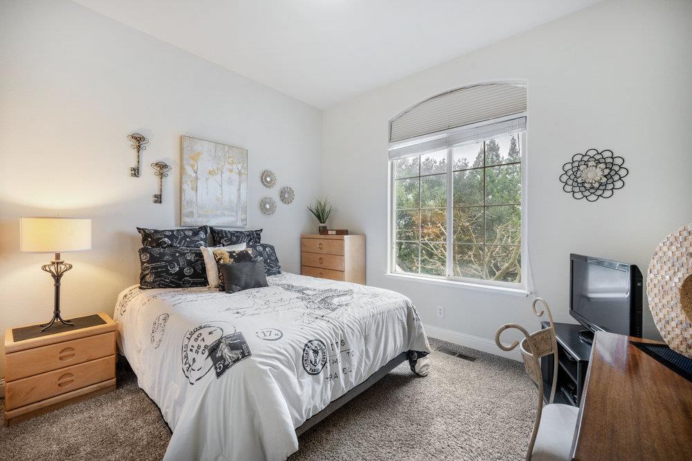 2360 Sunflower Circle Gilroy, CA 95020 - Photo 30 of 49 a bedroom with a bed and a table in it