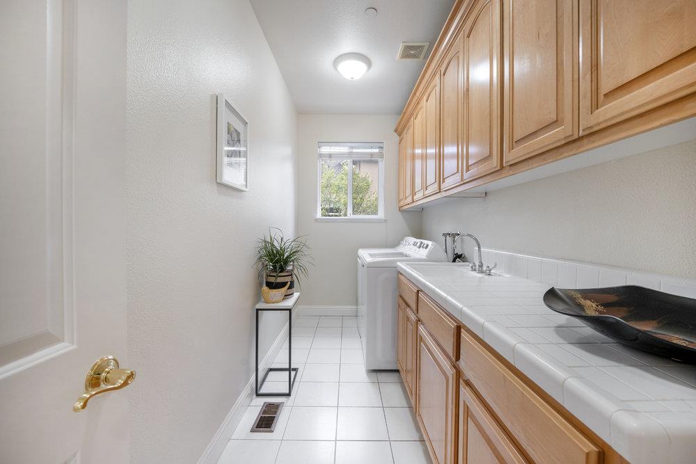 2360 Sunflower Circle Gilroy, CA 95020 - Photo 32 of 49 a kitchen with a sink and a refrigerator