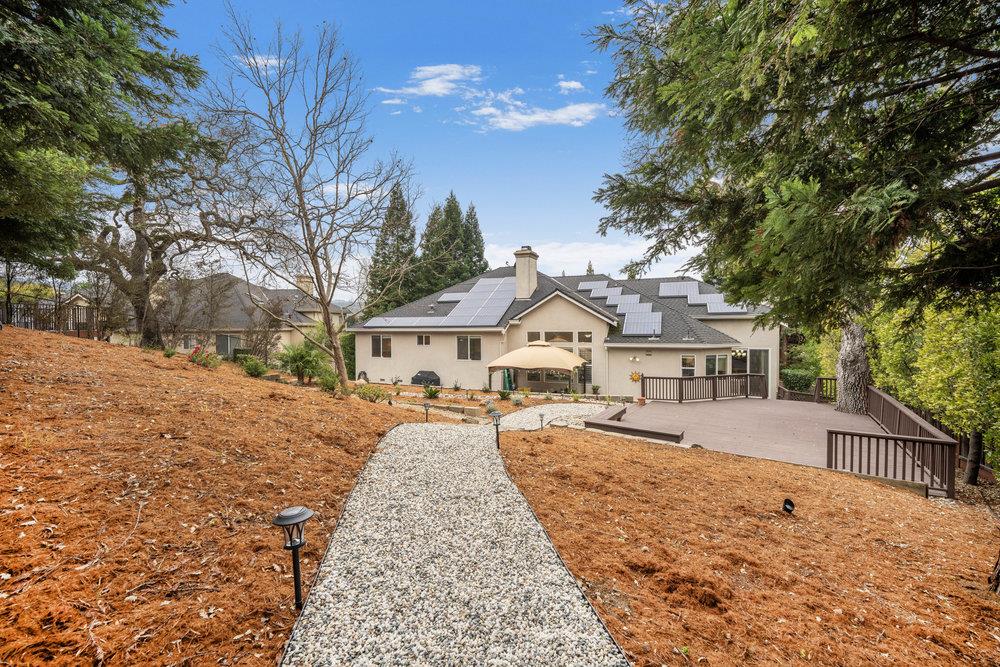2360 Sunflower Circle Gilroy, CA 95020 - Photo 34 of 49 a front view of a house with a yard covered with snow and trees