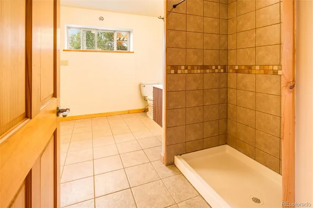 a view of staircase with wooden floor and a potted plant