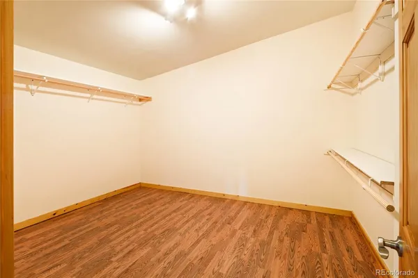 a view of a room with a ceiling fan