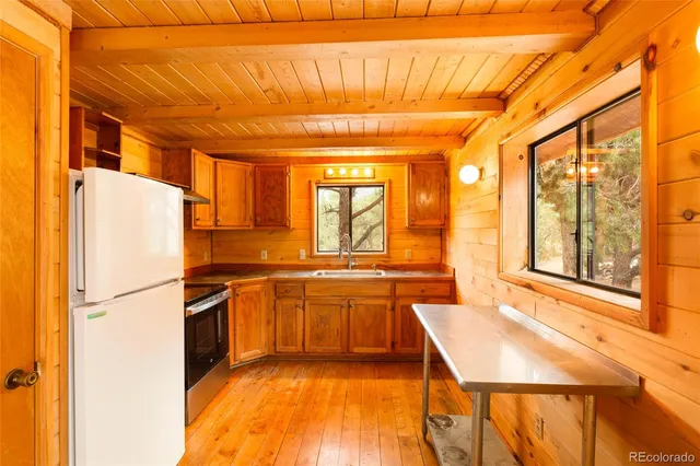 a view of a bathroom with a tub and a view of a bathroom