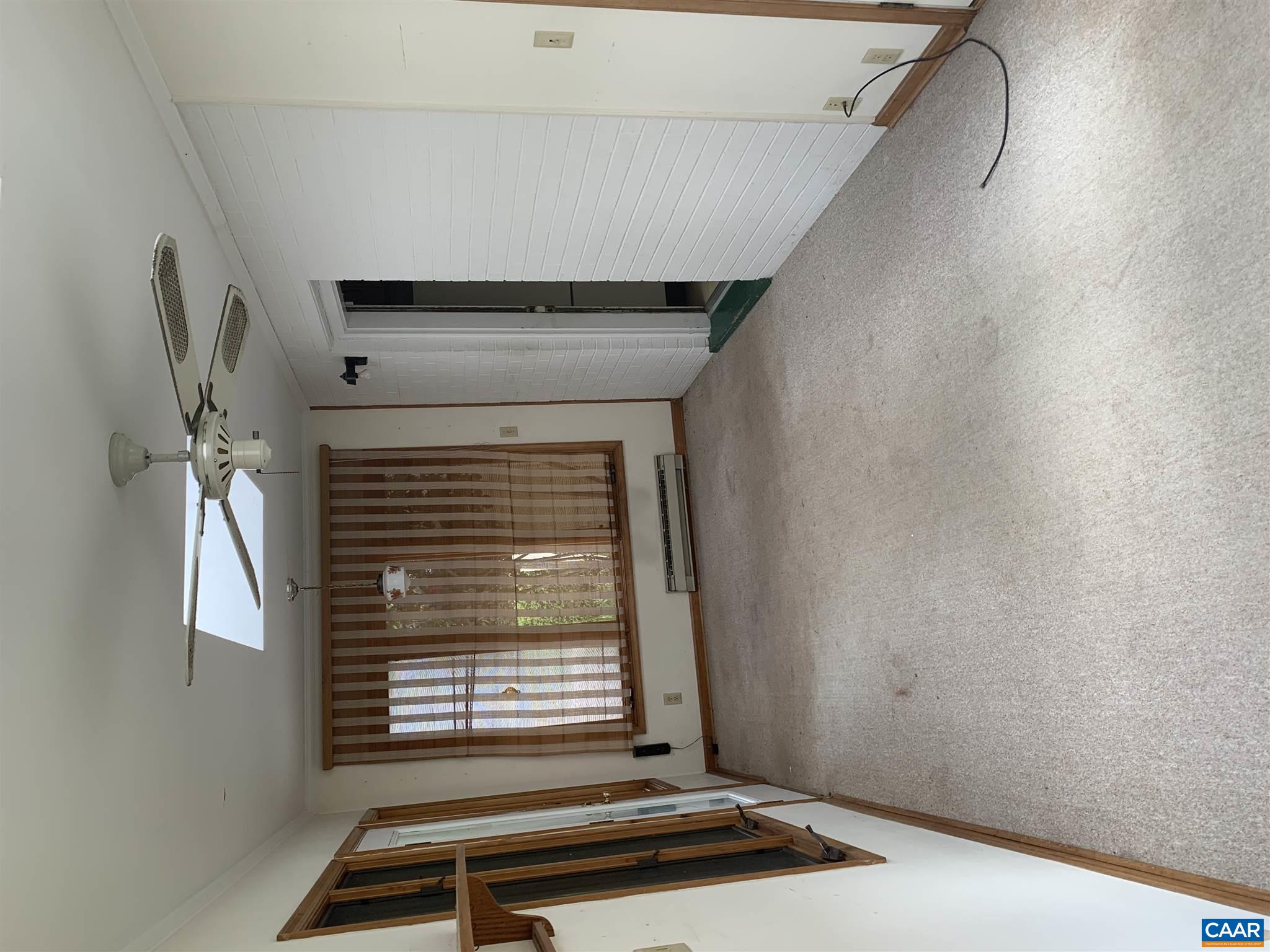 2701 Northfield Road Charlottesville, VA 22901 - Photo 18 of 30 a view of an empty room with a fireplace