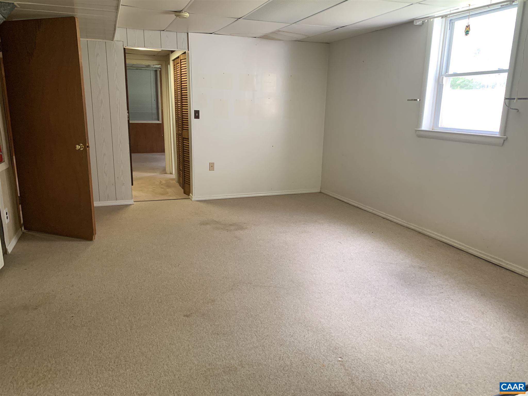 2701 Northfield Road Charlottesville, VA 22901 - Photo 23 of 30 an empty room with windows and closet
