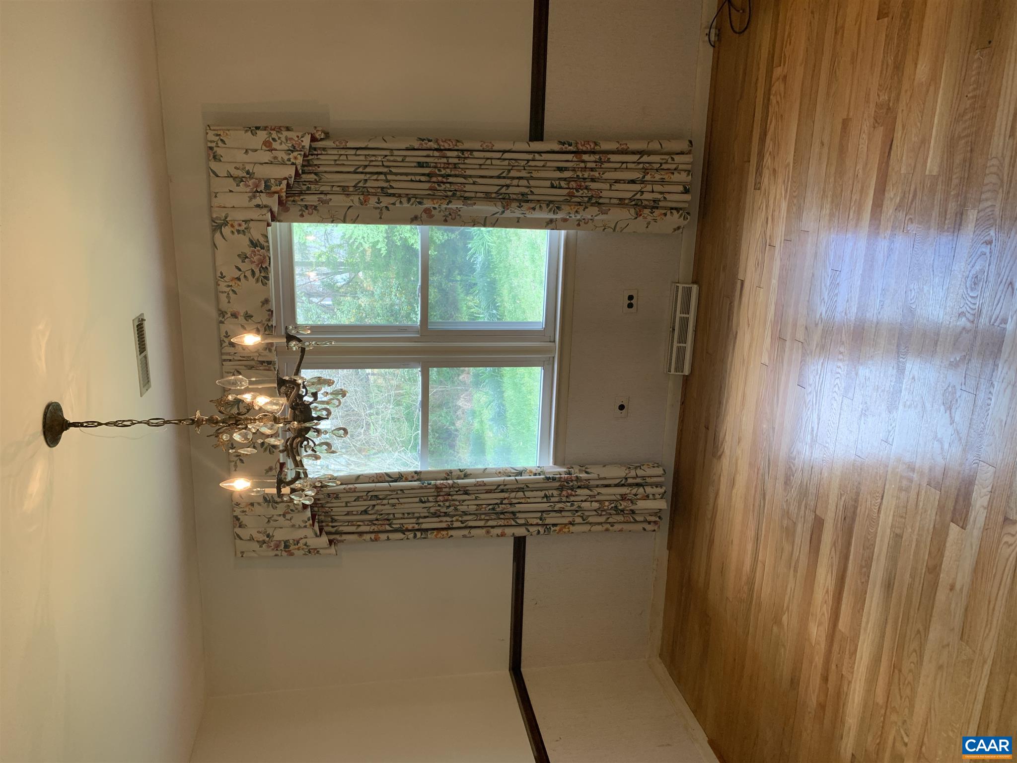 2701 Northfield Road Charlottesville, VA 22901 - Photo 3 of 30 a view of a room with wooden floor outdoor view and a window