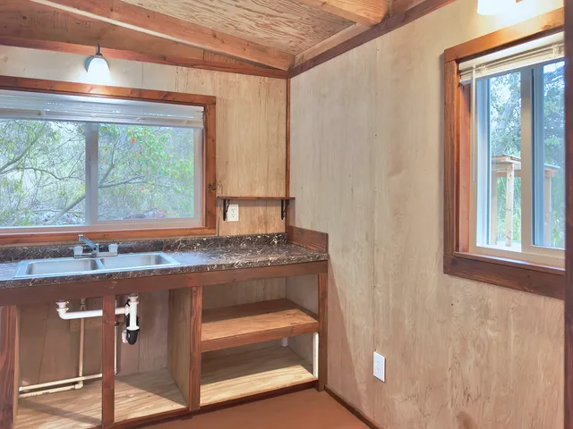 a house with a trees in the background