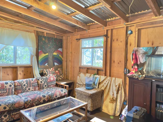 a kitchen that has a table and chairs in it