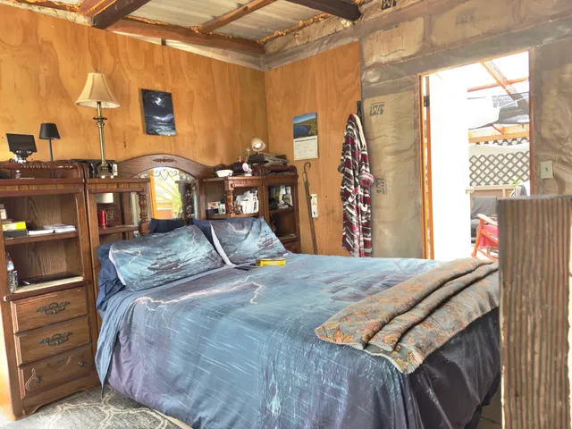 a view of a backyard with table and chairs