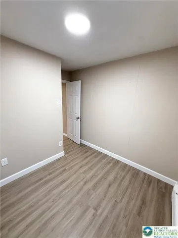 a view of a hallway view with staircase