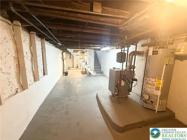 a view of bathroom with a shower and toilet