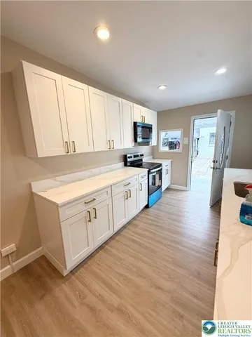 a bathroom with a sink toilet and a mirror