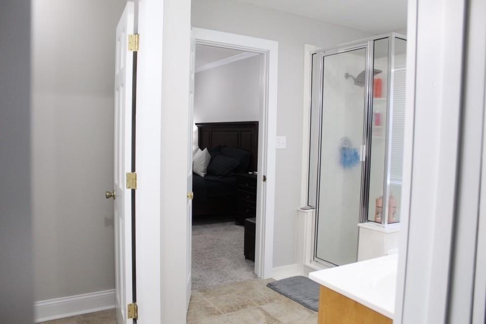440 Stewart Road Eads, TN 38028 - Photo 15 of 25 Bathroom featuring tile patterned floors and a shower with door