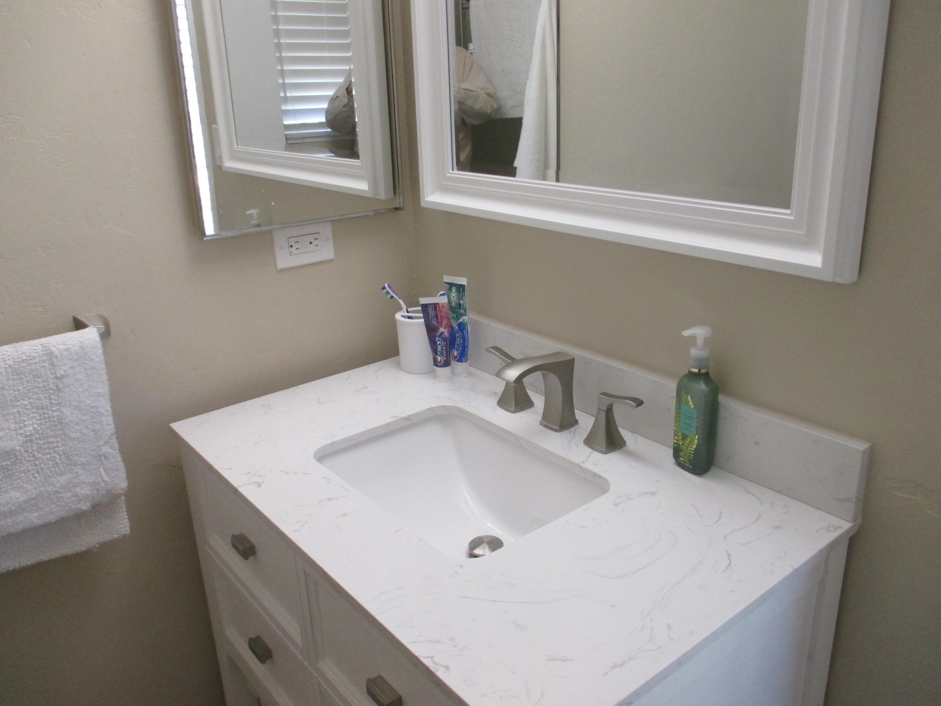 21908 Mariposa Road Tehachapi, CA 93561 - Photo 14 of 23 a bathroom with a sink and a mirror