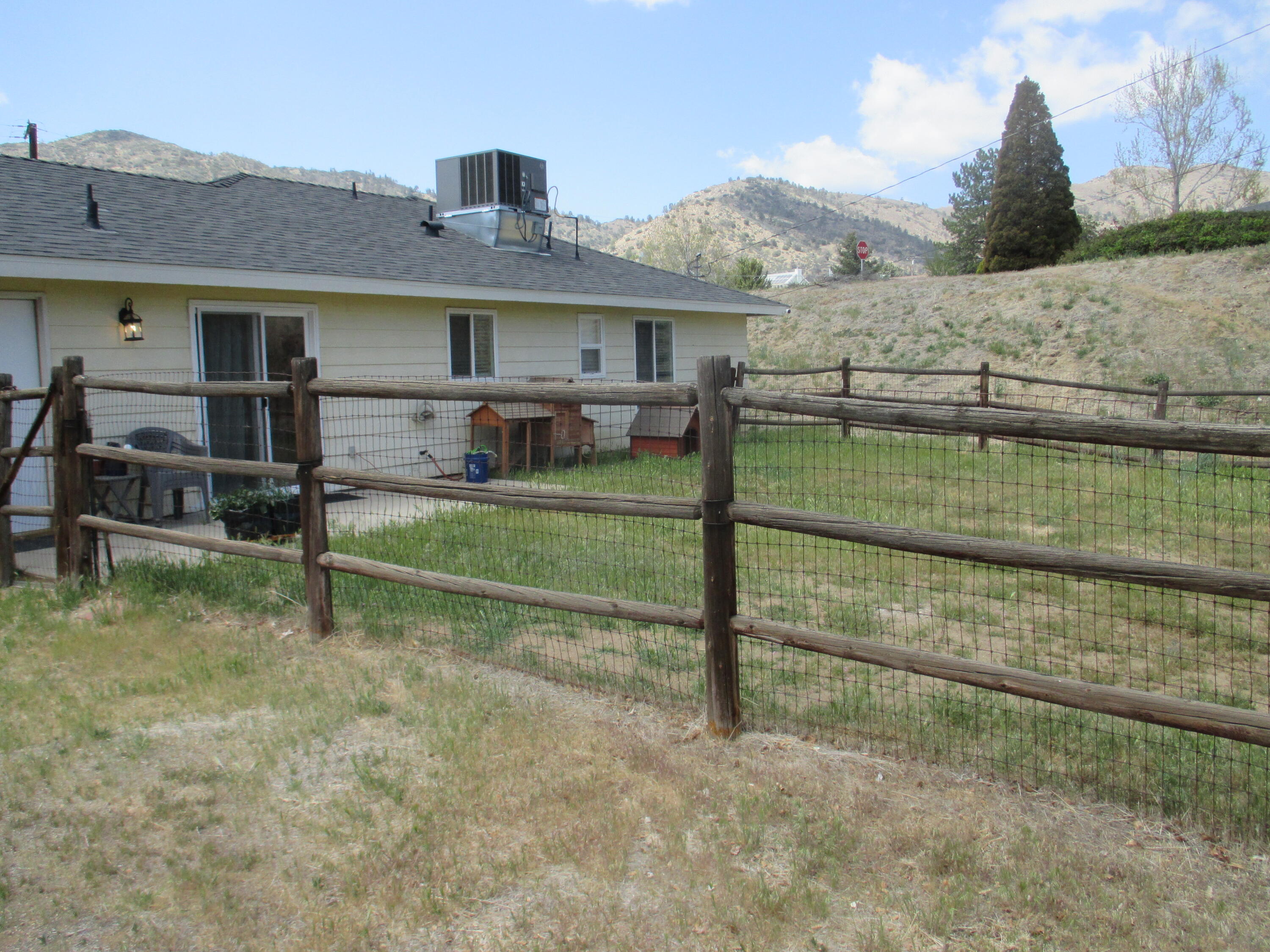 21908 Mariposa Road Tehachapi, CA 93561 - Photo 19 of 23 a view of a house next to a yard