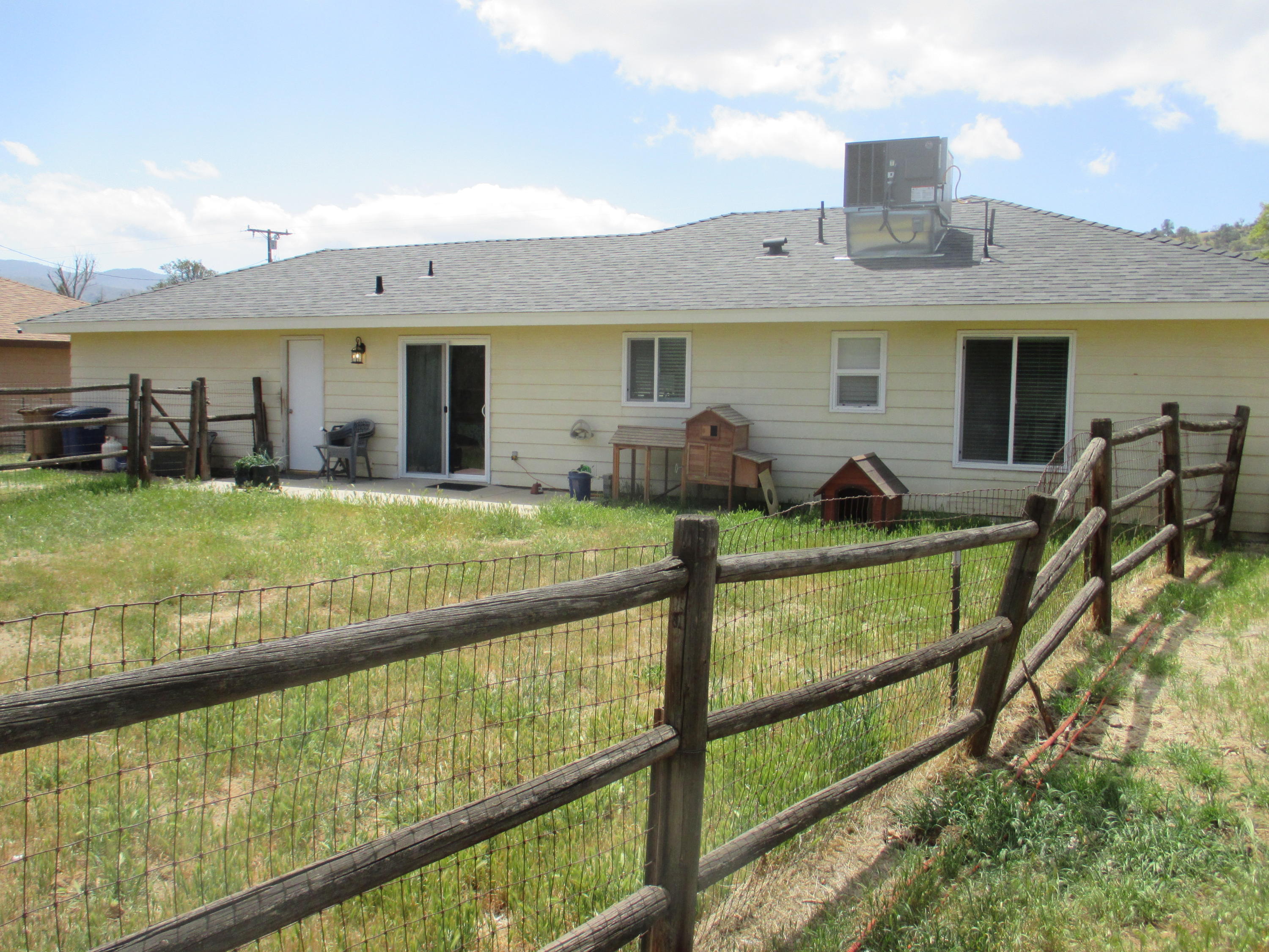 21908 Mariposa Road Tehachapi, CA 93561 - Photo 22 of 23 a view of a house with pool and chairs