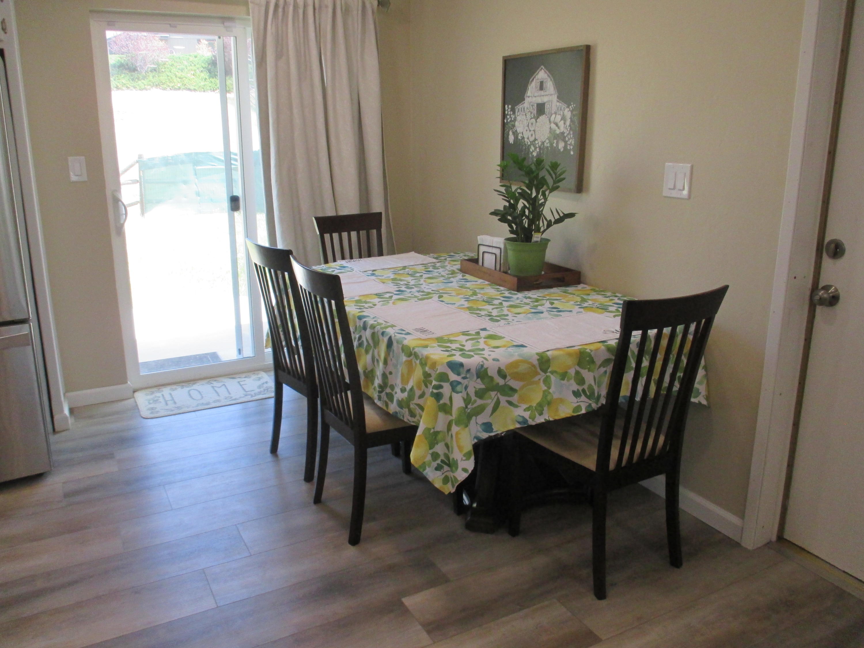 21908 Mariposa Road Tehachapi, CA 93561 - Photo 10 of 23 a view of a dining room with furniture and wooden floor