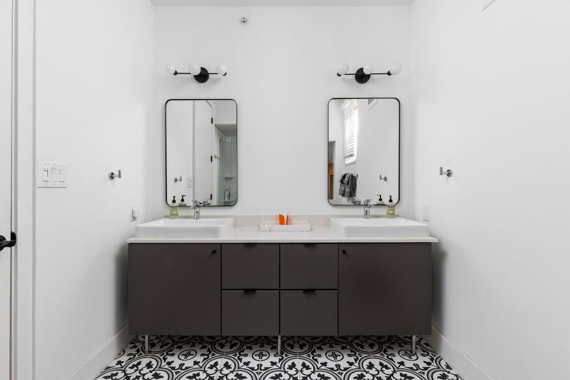 2709 East 5th Street, Unit 1306 Austin, TX 78702 - Photo 16 of 26 Primary bathroom with dual vanity and clean modern finishes.