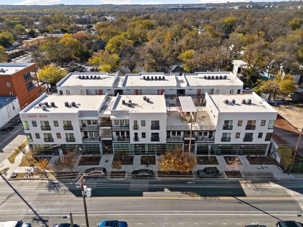 2709 East 5th Street, Unit 1306 Austin, TX 78702 - Photo 22 of 26 Community view showcasing condo building, commercial spots, and surroundings.