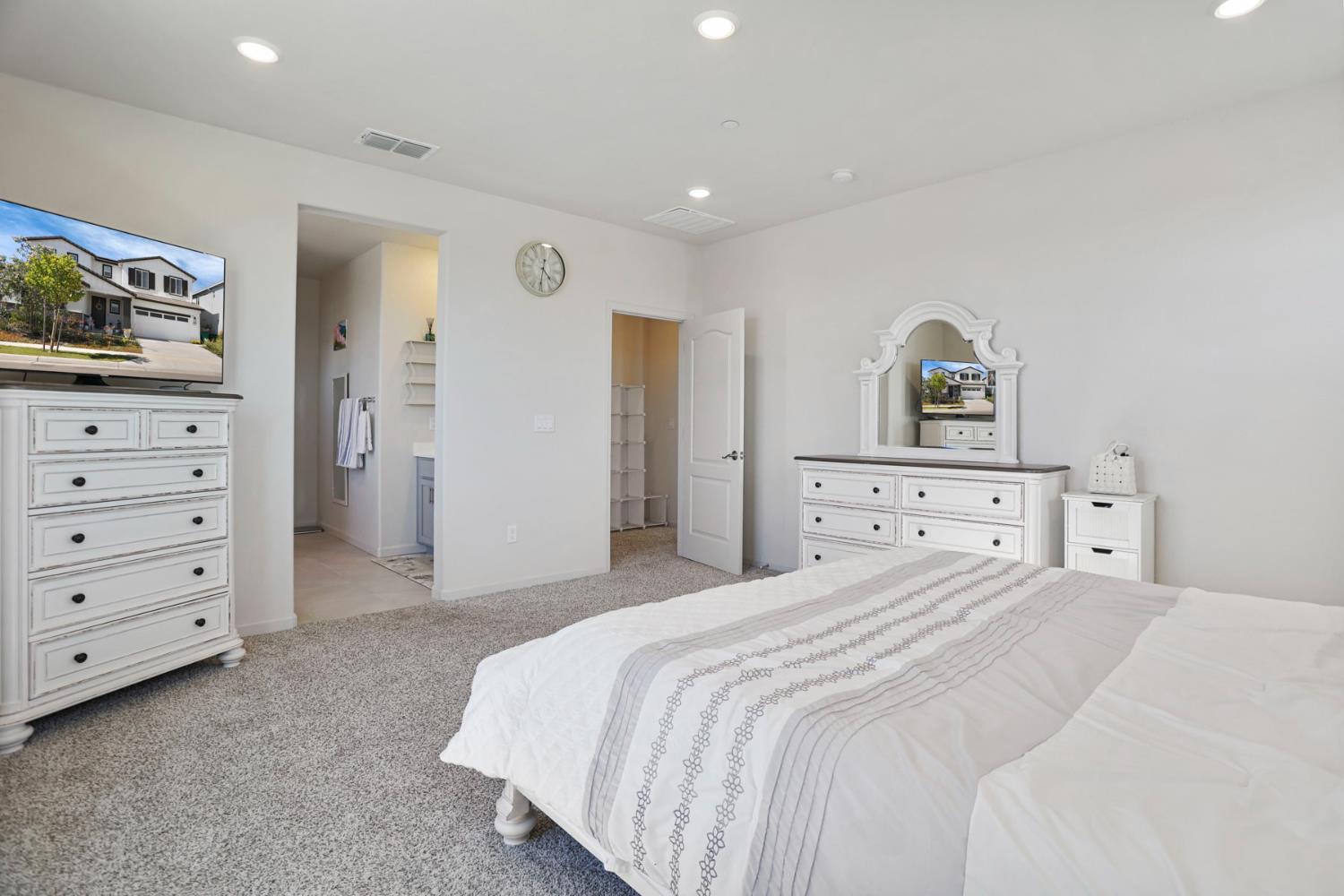 6949 Foraker Drive Stockton, CA 95219 - Photo 26 of 34 a bedroom with a bed and a television